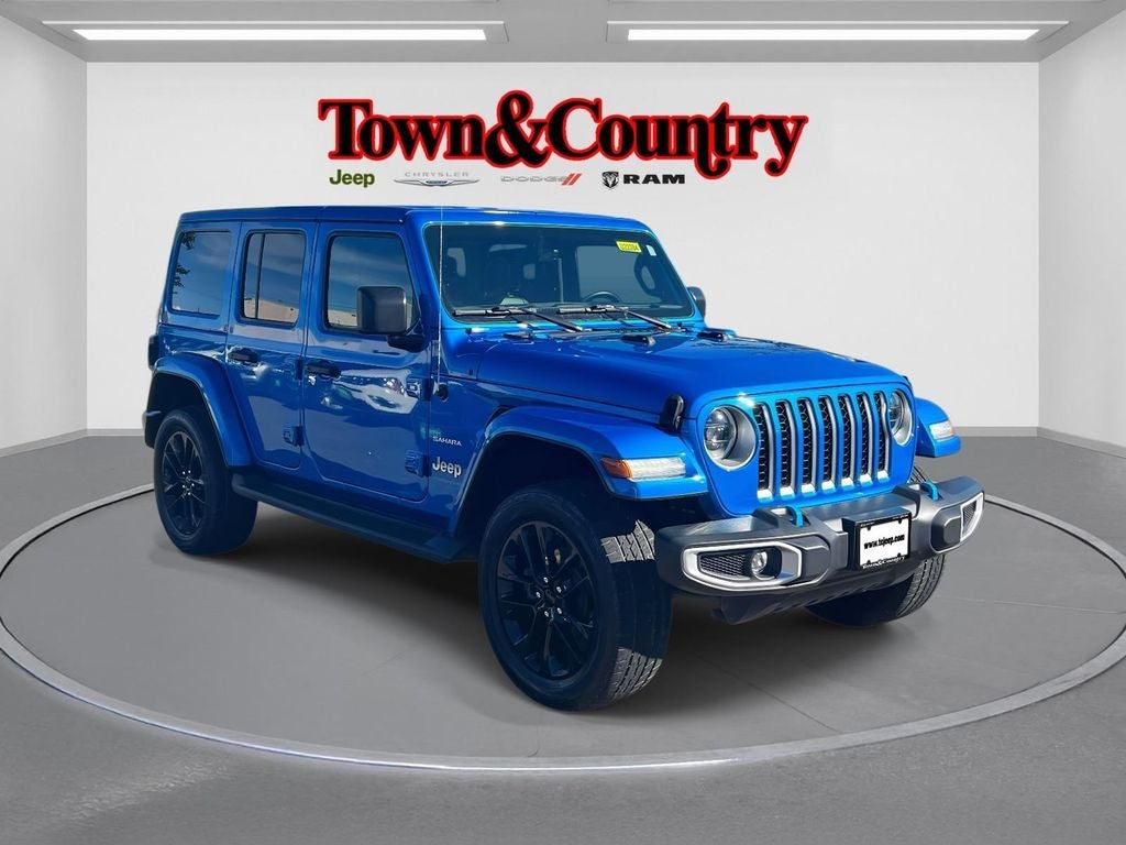 2023 Jeep Wrangler Sahara 4xe in Hydro Blue Pearl Coat — front three-quarter view