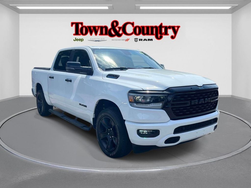 2023 RAM 1500 Big Horn Crew Cab 4x4 5'7' Box in Bright White Clearcoat — front three-quarter view