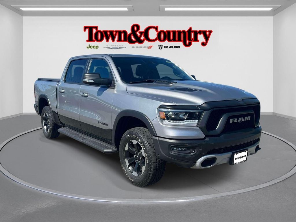 2021 RAM 1500 Rebel Crew Cab 4x4 5'7' Box in Billet Silver Metallic Clearcoat — front three-quarter view